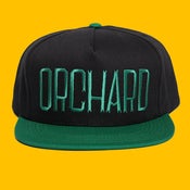 Image of Orchard Black/Green Text Snapback Hat