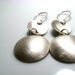 Image of inside out disks. earrings. sterling silver.