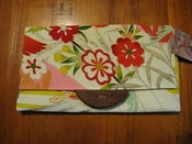 Image of Migoto with wooden button