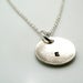 Image of initial pod. circle. pendant. sterling silver.