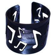 Image of Music Note Bracelets cut out of recycled BLACK and RED vinyl records.