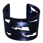 Image of Lightning Bolt Bracelets cut out of recycled BLACK and RED vinyl records.