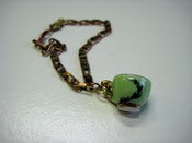 Image of Feather tea cup charm bracelet
