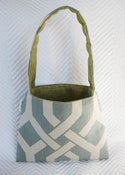 Image of pale blue geometric/ metalic green