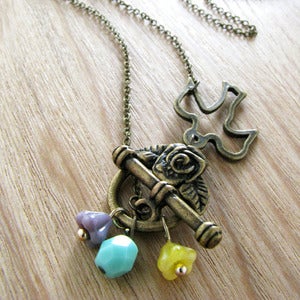 Image of dove in rose garden front toggle necklace
