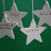 Image of personalised christmas star ornaments
