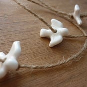 Image of bird garlands - dark jute