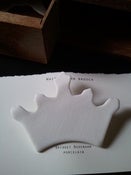 Image of porcelain crown brooch