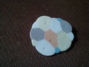 Image of colourful cloud brooch