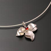 Image of Sterling Lotus Pendant with Garnet Center
