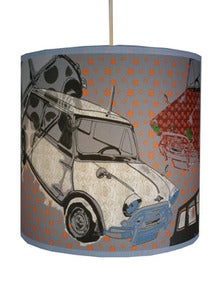 Image of 10" tube shade, grey background with coloured mini's and orange flashes