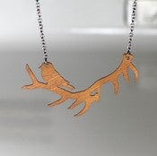 Image of Bird Resting On Antlers Necklace-Reversible Stainless Steel and Wood 