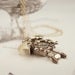 Image of vintage cuckoo clock with gold chain 