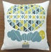 Image of ballooning cushion on white cotton barkcloth