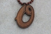 Image of oneness x goodwood "O" logo 
