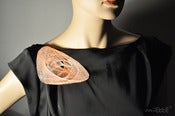 Image of spiro brooch irregular ellipsoid superposition