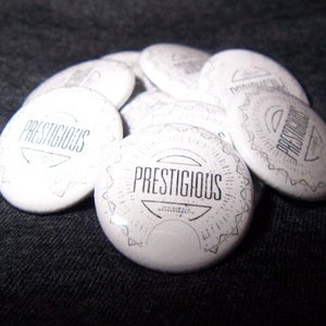 Image of NEW! Prestigious BADGE 1" Button (white w/black 1" button)
