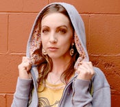 Image of blue with plaid pockets and bright floral hood lining with monster lolli back!