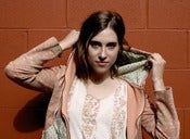 Image of Swirled orange, pinks, and greens hoodie with Floral fabric