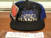 Image of VINTAGE ORLANDO MAGIC TEXT THE GAME SNAPBACK CAP HAT