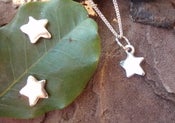 Image of star earrings and matching pendant