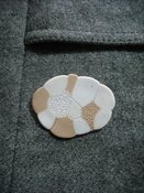 Image of small colourful brooch