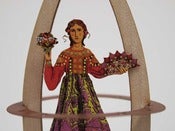 Image of Time Traveling Paper Doll with flat pack Rocket