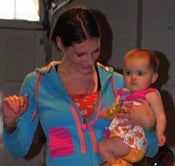 Image of blue hoodie with pink lace trim, pink button pull, and vintage cartoon lined hood.
