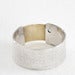 Image of sterling silver and 18k gold papyrus ring with blue zircon stone