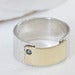 Image of sterling silver and 18k gold papyrus ring with blue zircon stone