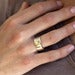 Image of sterling silver and 18k gold papyrus ring with blue zircon stone