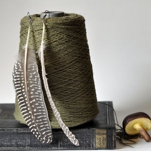 Image of feather earrings by drucilla pettibone.