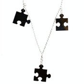 Image of Puzzle Adapter Charm Necklace made from recycled vinyl records.