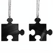 Image of Puzzle Piece BFF Necklaces made from a recycled vinyl record.