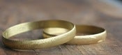 Image of round flat brass bracelet