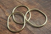 Image of 3 small oval brass bracelets