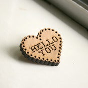 Image of heart-shaped hello you brooch