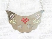 Image of Handcut Silver Cross Stitch Necklace with Birds