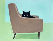 Image of cat on a mid century chair