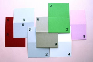 Image of Rubber stamped number place cards
