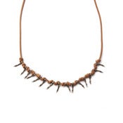 Image of fifteen small silver branches on 30" wax-coated cotton w/ silver caudal vertebrae closure (P1115sil3