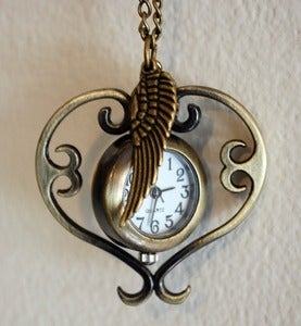 Image of Winged Spinning Heart Watch Necklace
