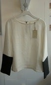 Image of TM by Marlen Karema  white and black top