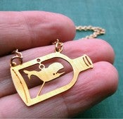 Image of whale in a bottle necklace - vintage brass necklace