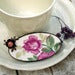 Image of Broche vintage en porcelaine avec le motif d'une rose