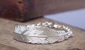 Image of silver feather bracelet