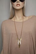 Image of large gold, silver and copper multi leaf blade necklace