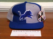 Image of DEADSTOCK VINTAGE DETROIT LIONS STARTER "PINWHEEL" LOGO SNAPBACK CAP HAT