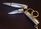 Image of Period Three Implies Chaos/Readymade Contraption of Descent (USB/Bullet)