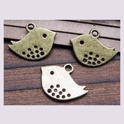 Image of Pendentif little birds à pois ajourés